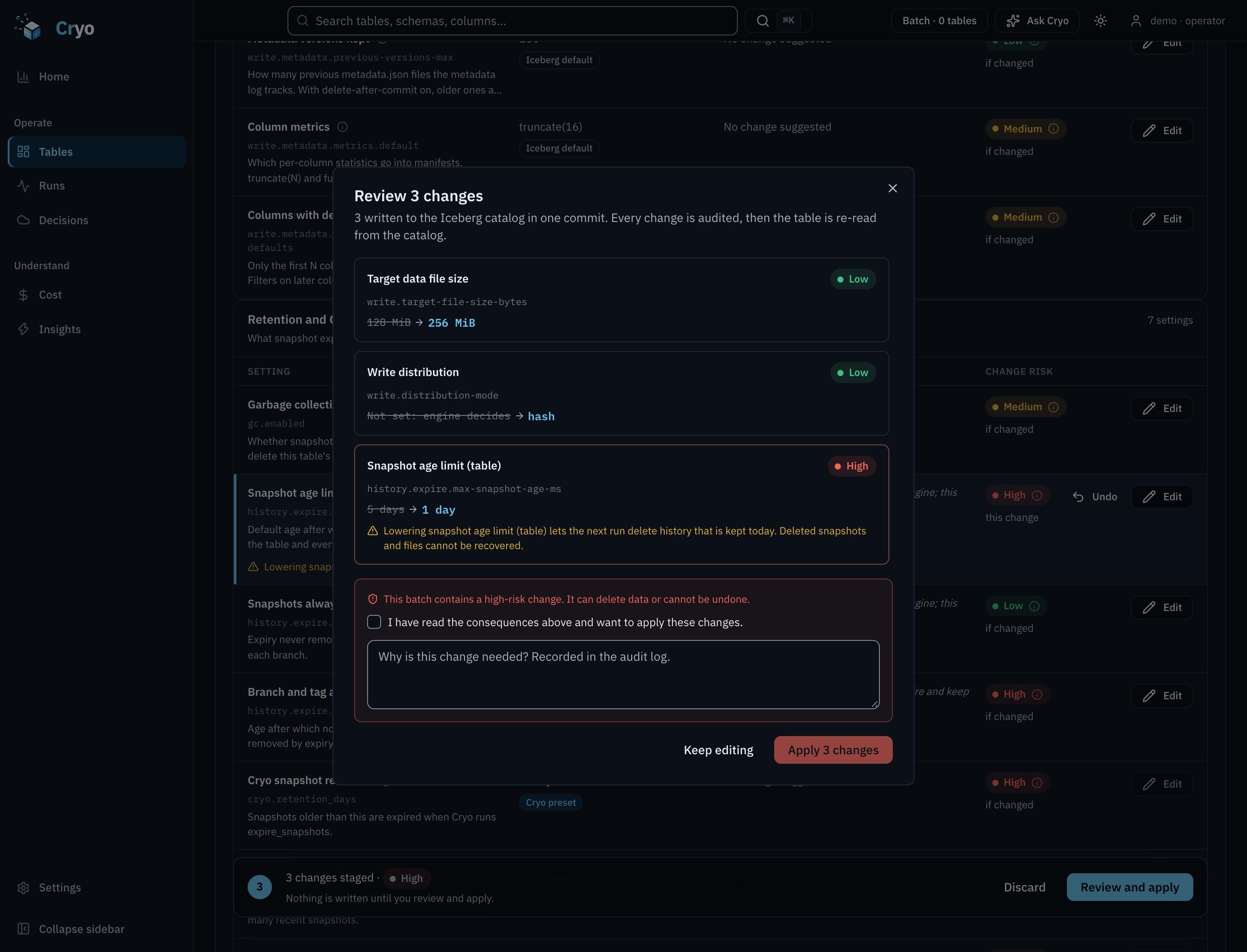 Review dialog for three staged changes: write.target-file-size-bytes to the recommended value, write.distribution-mode to the recommended value, and history.expire.max-snapshot-age-ms to 1 day. A warning reads that this batch contains a high-risk change, with a reason field and an acknowledgement checkbox.